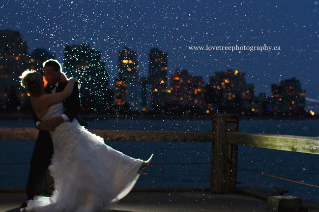 Vancovuer city skyline in the background of a beautiful rainy day wedding portrait ; image by www.lovetreephotography.ca