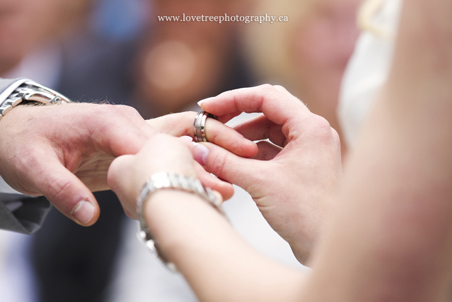 exchanging wedding rings image by destination wedding photographers www.lovetreephotography.ca