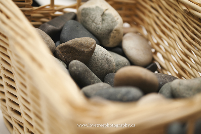 get guests at a wedding to sign rocks! image by wedding photographers www.lovetreephotography.ca