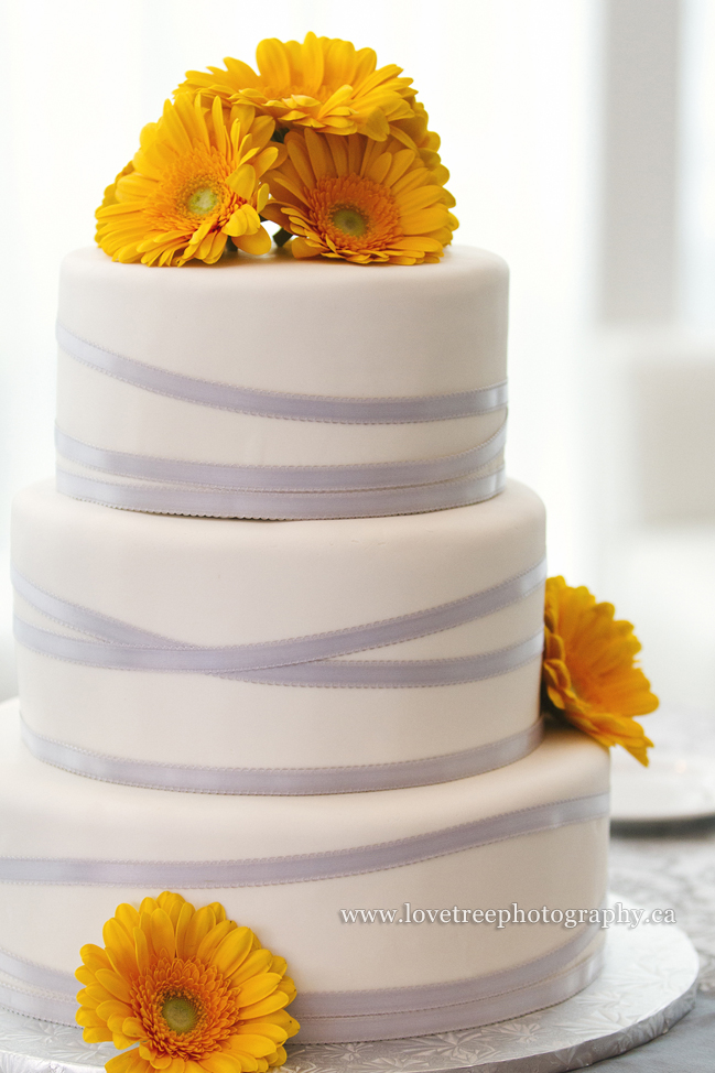 grey and yellow wedding cake image by wedding photographers www.lovetreephotography.ca