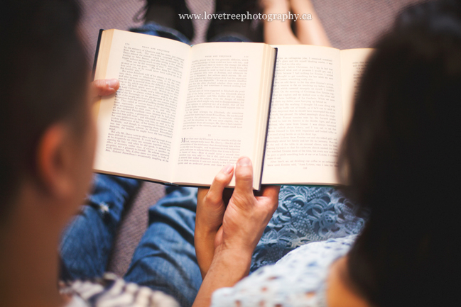 reading together in the library ; image by vancouver wedding photographers www.lovetreephotography.ca