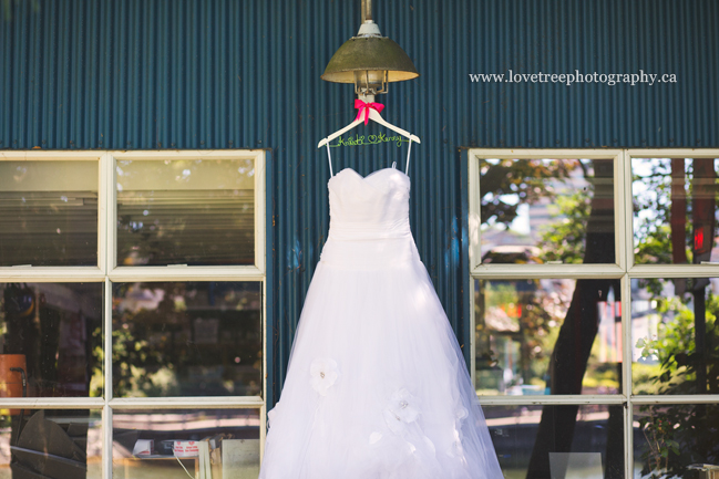 wedding dress hanging at granville island - image by vancouver wedding photographers www.lovetreephotography.ca