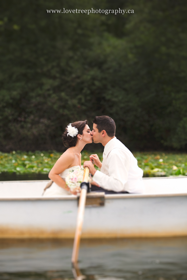 bride and groom in a rowboat by love tree photography