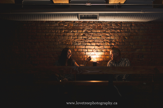 Casual engagement session in a bar in Vancouver. Images by award winning wedding photographers www.lovetreephotography.ca