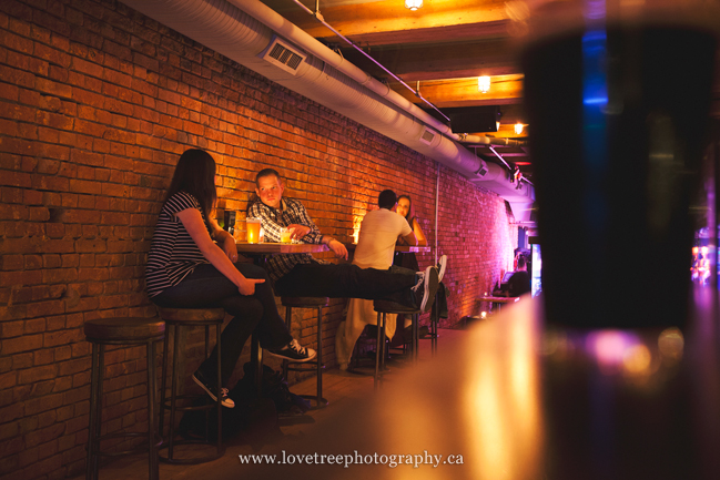 A fun engagement session in a bar in Vancouver. Images by award winning wedding photographers www.lovetreephotography.ca