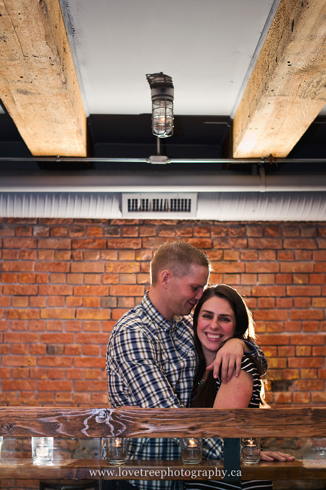 A fun engagement session in a bar in Vancouver. Images by award winning wedding photographers www.lovetreephotography.ca