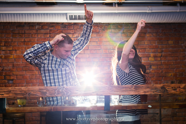Offbeat engagement session at The Portside Pub in Gastown, Vancouver. Images by award winning wedding photographers www.lovetreephotography.ca